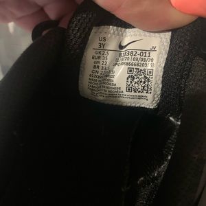 Black Nike youth shoes. Size 3Y.